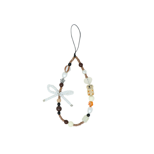 Caser Custom Brown Ivory Capybara Bow phone charm, detail view