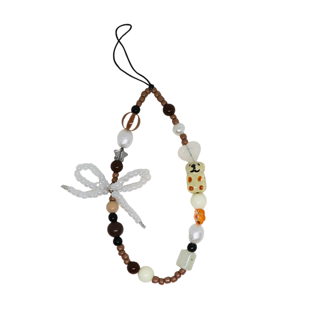 Caser Custom Brown Capybara Pearl Bow phone charm, detail view