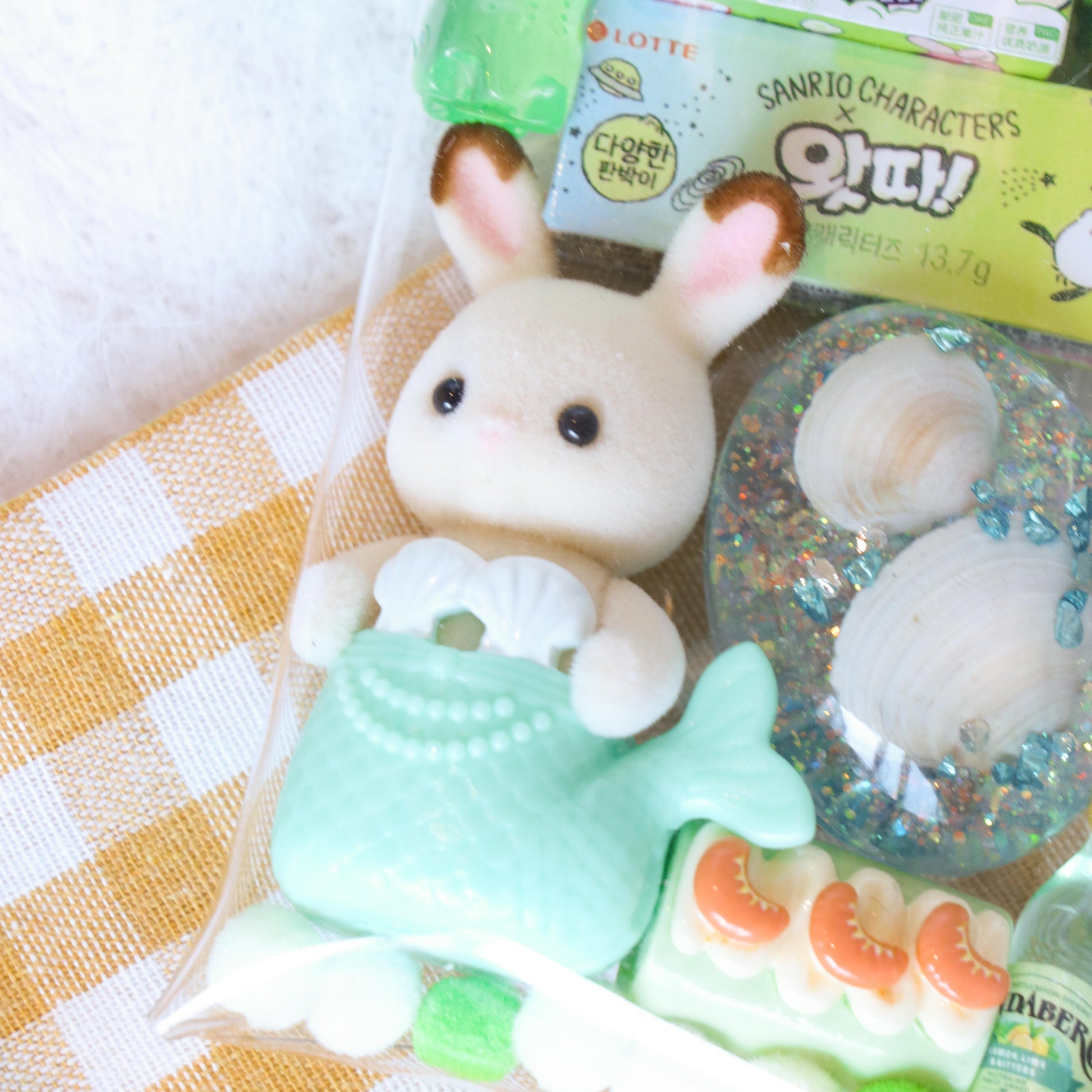 Kawaii plush toy with a checkered tablecloth background